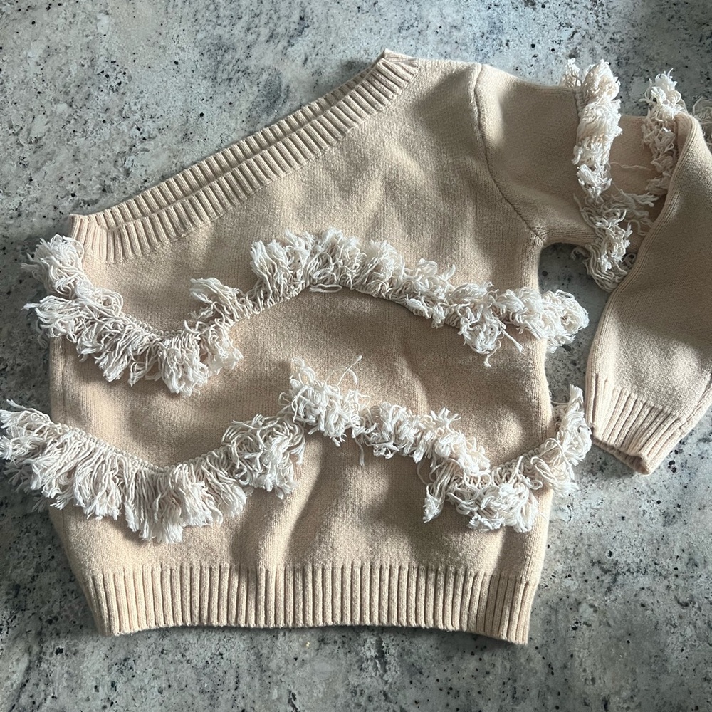 Pink Lily Cream Off-the-Shoulder Sweater with Fringe